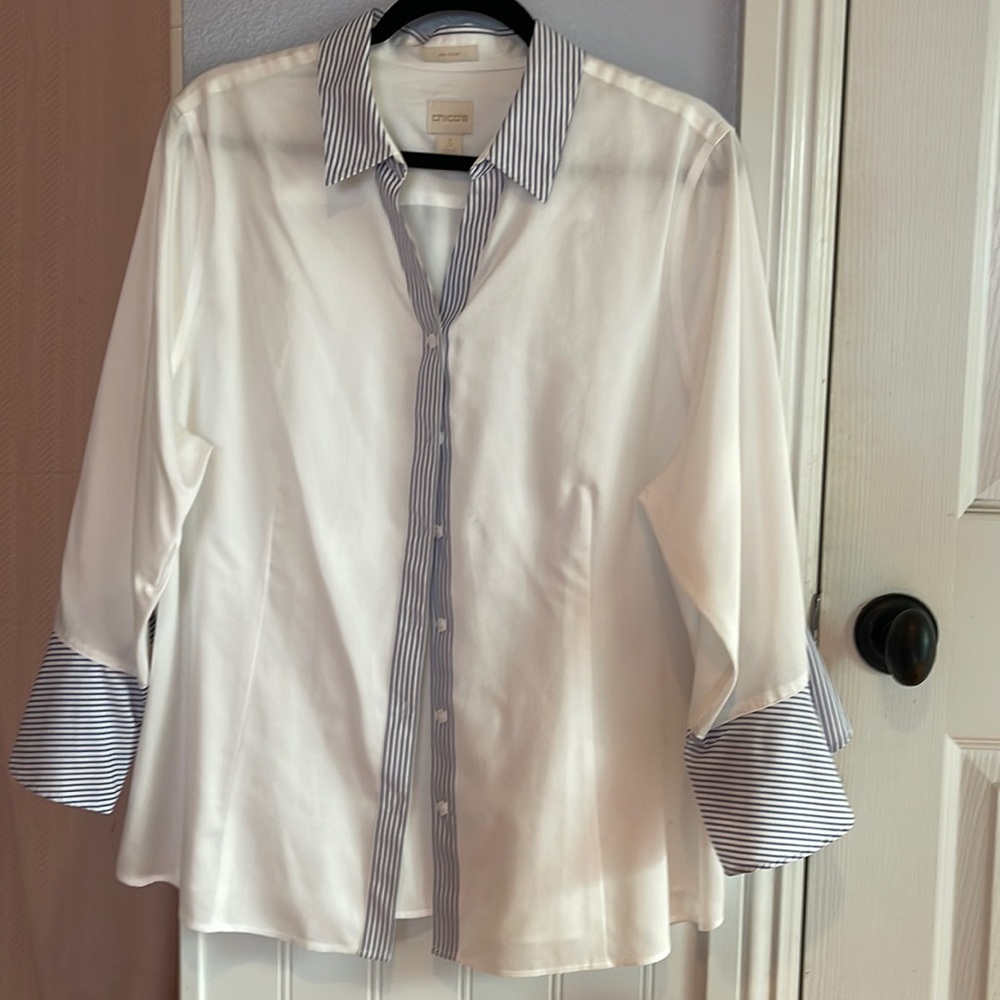 Chico’s white collared shirt with blue striped trim.
